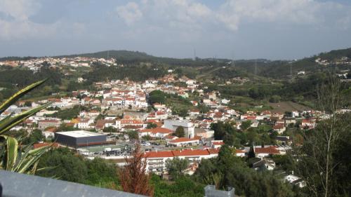 a view of a town with buildings and trees at Casa do Jorge in Leiria