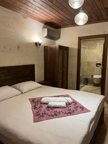 Postel nebo postele na pokoji v ubytování UCHI Cappadocia