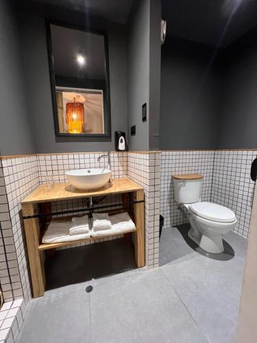 a bathroom with a sink and a toilet at Casa Tunki in Cusco