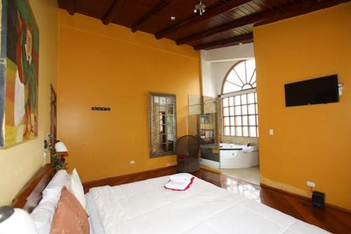 Katil atau katil-katil dalam bilik di Hosteria Loma Larga Cayambe