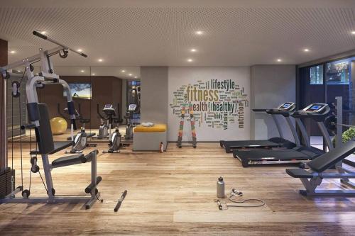 a gym with several treadmills and exercise bikes at 92 New studio next Paulista Av, fast wifi and balcony in Sao Paulo