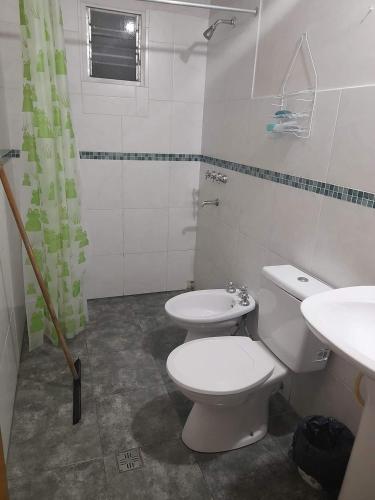 a bathroom with a toilet and a sink at Casa Carina in Yala