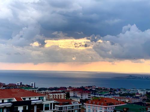 a view of the ocean from a city at sunset at dream house in istanbul in Istanbul