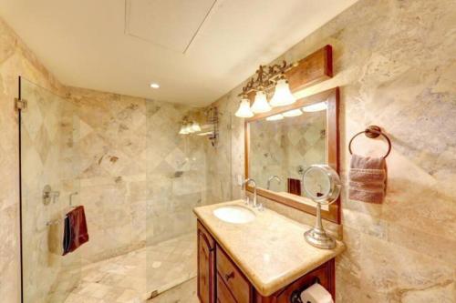 a bathroom with a sink and a shower at Prime Cabo Stylish Studio Near Beach and Marina in Cabo San Lucas