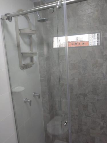 a bathroom with a shower with a glass door at Casa Jac in Bucaramanga