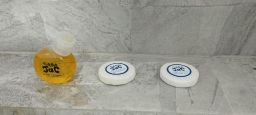 two bottles of soap and a bottle of mustard at Casa Jac in Bucaramanga