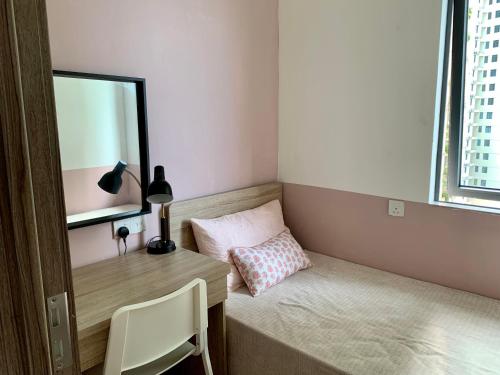 a small room with a desk and a window at Sea view 2 bedroom Fully furnished Apartment Forest City Starview Bay Johor Malaysia in Kampong Pok Kechil