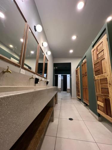 a bathroom with two sinks and a large mirror at Casa Tunki in Cusco