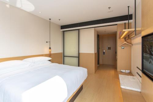 Ένα ή περισσότερα κρεβάτια σε δωμάτιο στο Fairfield by Marriott Liaocheng Dongchangfu