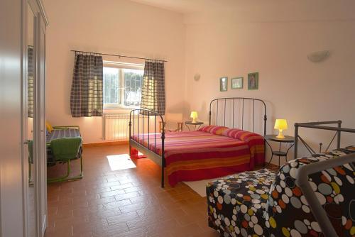 a bedroom with two beds and a window at Country House Case Di Stratola in Montella