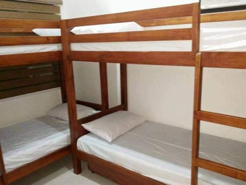 Postel nebo postele na pokoji v ubytování Paradise Beach House D-2