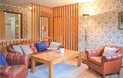 a living room with a couch and two chairs and a table at Awesome Home In Asarum With Wifi in Asarum