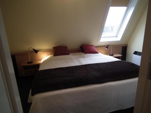Llit o llits en una habitació de Hollumerstrand