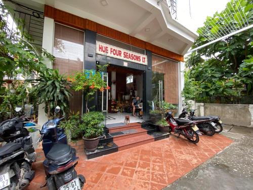 a group of motorcycles parked outside of a building at Hue Four Seasons Hotel in Hue
