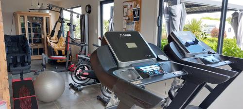 a room with a gym with a treadmill at Self Contained 2BR holiday unit in Richmond Tasman in Richmond