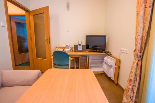 TV a/nebo společenská místnost v ubytování Farys - świetna lokalizacja, sauna, jacuzzi, piękne widoki z okien
