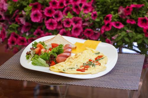 a plate of food on a table with a plate of food at Aristokrat in Vinnytsya