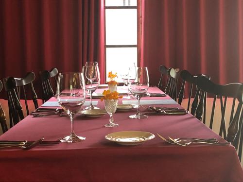 a table with wine glasses and silverware on it at 洲本家　SUMOTOYA in Sumoto