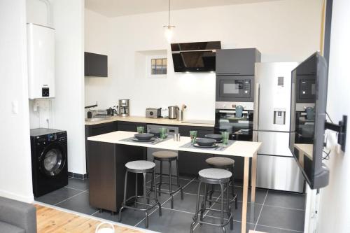 Kuchyň nebo kuchyňský kout v ubytování Grand Appartement Confort
