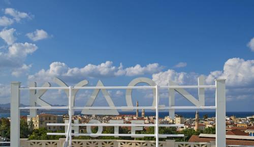 a large metal sign on top of a city at Kydon The Heart City Hotel in Chania Town