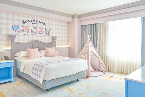 a pink bedroom with a bed and a tent at Grand Hi Lai Hotel in Kaohsiung