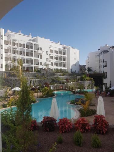 Bazén v ubytovaní Palmmar Jardines NEW 2bedroom ISORA 0-4 House 105m2 with garden alebo v jeho blízkosti