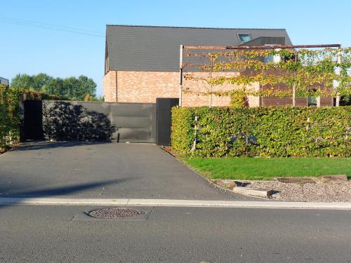 an empty street in front of a building at La Couture du Charme in Saméon