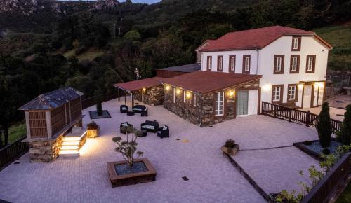 an aerial view of a house with a patio at Casa Rural San Andrés de Teixido in Cedeira