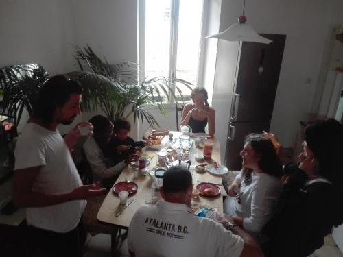 a group of people sitting around a table at Plan B in Imperia