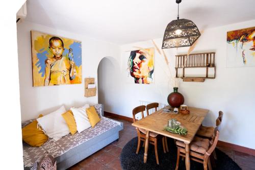 a living room with a couch and a table at A natural retreat in Mijas