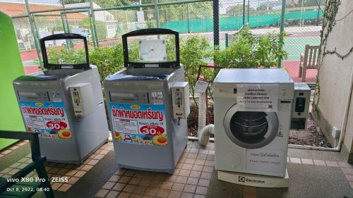 a group of automated machines sitting on a sidewalk at Boathouse Hua Hin Seaview in Ban Bo Fai