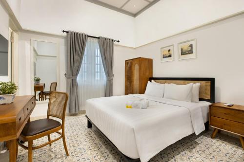 Postel nebo postele na pokoji v ubytování CERIA HOTEL at Alun Alun Yogyakarta