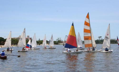 a group of small sailboats on the water at Casa em Condomínio com Piscina Privativa in Araruama