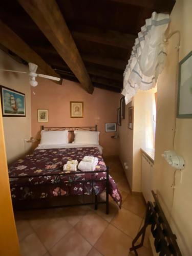 a bedroom with a bed in a small room at Antico Borgo in Fornelli
