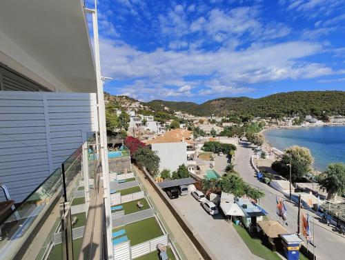 a view of a city from a building at New Aegli Resort Hotel in Poros