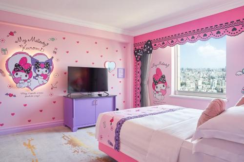a pink bedroom with a bed and a window at Grand Hi Lai Hotel in Kaohsiung