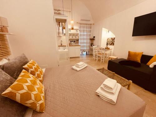 a living room with a large bed in a room at Casa di zia Pupetta in Bari