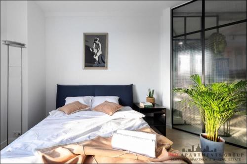 Postel nebo postele na pokoji v ubytování P&O Apartments Bitwy Warszawskiej - Ochota