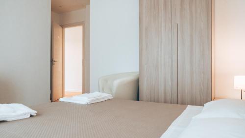 Postel nebo postele na pokoji v ubytování Guesthouse Aschenez