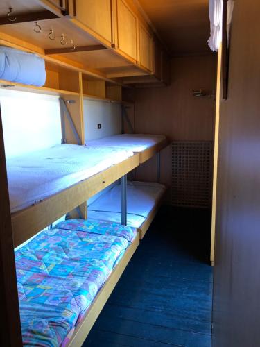 two bunk beds in a small room at Appartamento per max 6 pers nel centro di San Martino di Castrozza n 31 in San Martino di Castrozza