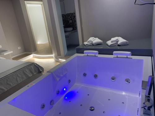 a bathroom with a large tub in a room at Caos Calmo in Rome