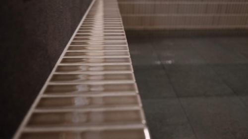 a long exposure photo of a stairway in a building at Kobayashiya -Kinosaki Onsen- in Toyooka