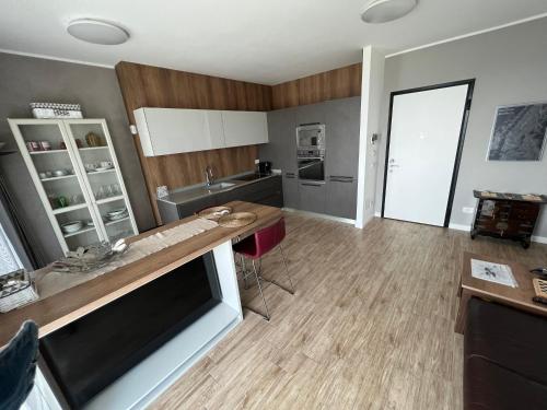 a kitchen with a table and a counter top at SKYLINE MILANO Fiera in Milan