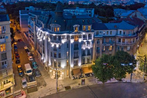 an aerial view of a building with lights at Hotel Venezia by Zeus International in Bucharest