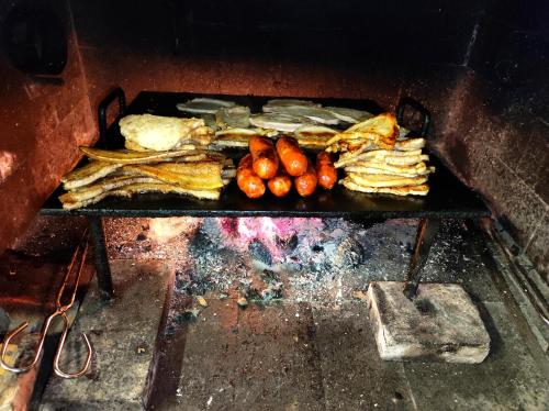 a grill with a bunch of food on at La Casa de las Nereidas in Cuenca