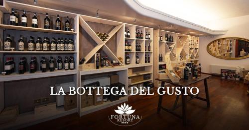 a room filled with lots of bottles of wine at Fortuna Resort in Chianciano Terme