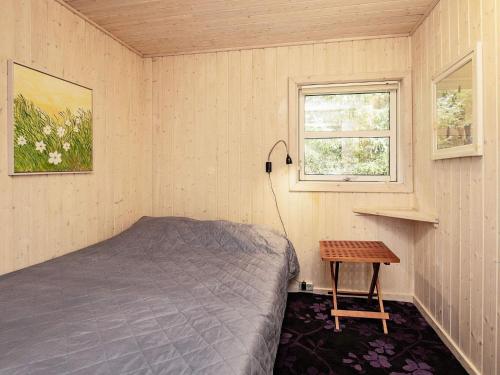 Säng eller sängar i ett rum på Holiday home Blokhus LVII