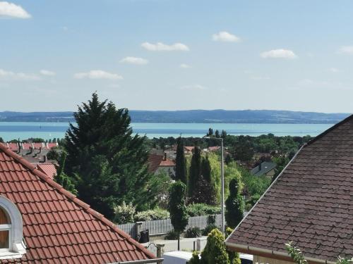 a view of the lake from the roofs of houses at Landhaus Forrás 2 in Balatonfüred