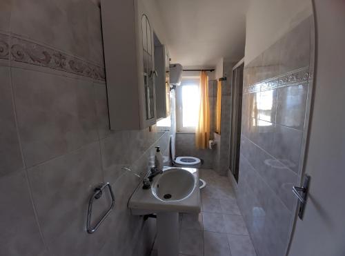 a small bathroom with a sink and a shower at Casa Sant'Ercolano in Perugia