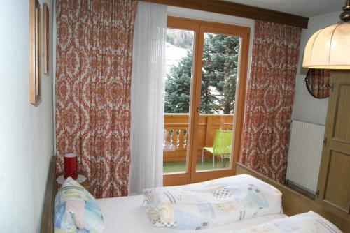 Säng eller sängar i ett rum på Gästehaus Lackner